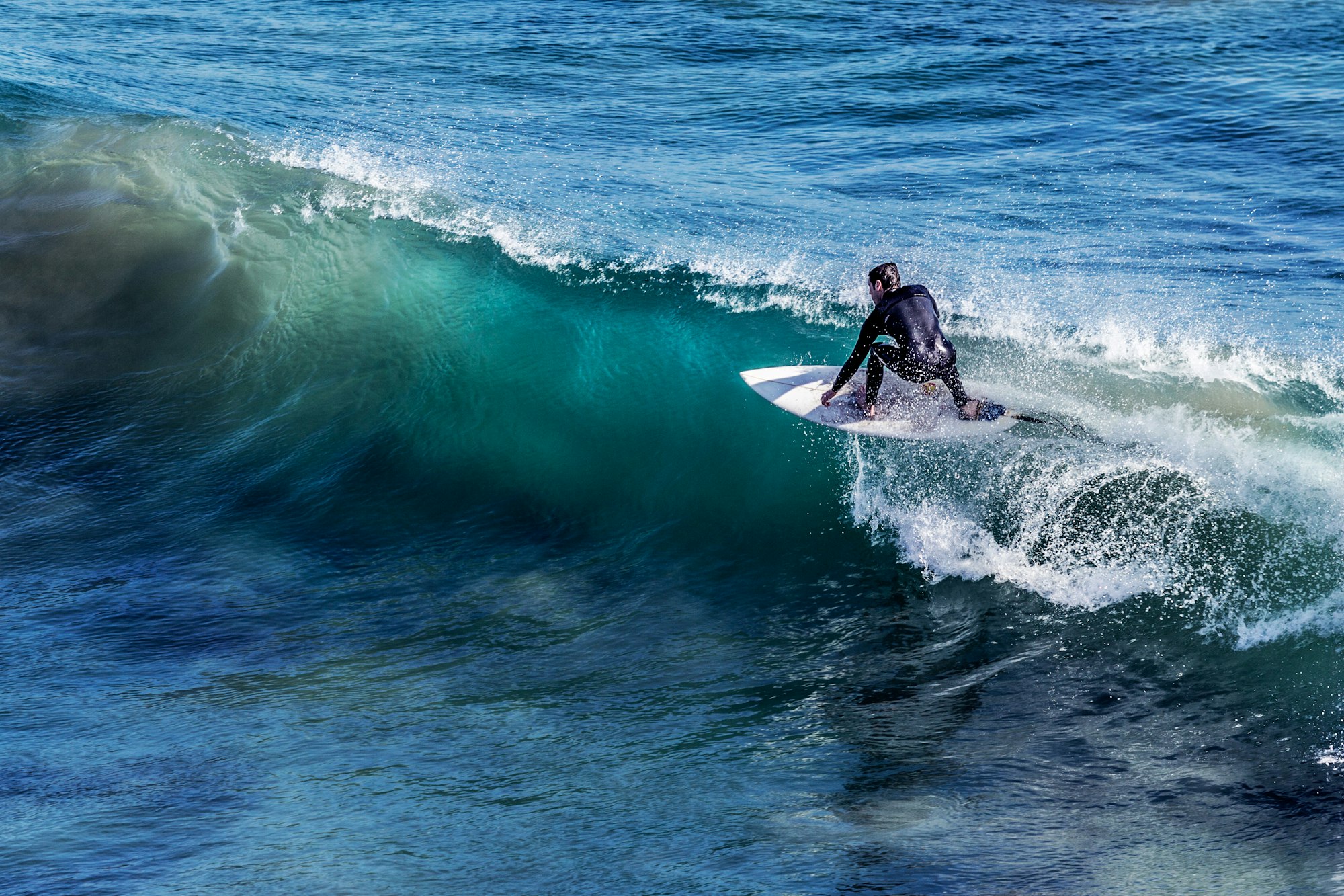 Aerial view of empty waves rolling onto a tropical reef